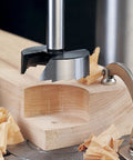 Battle Tested 16 Piece Forstner Drill Bit Set With Wood Storage Case And Killer Saw Tooth Design creating a precise hole in wood.