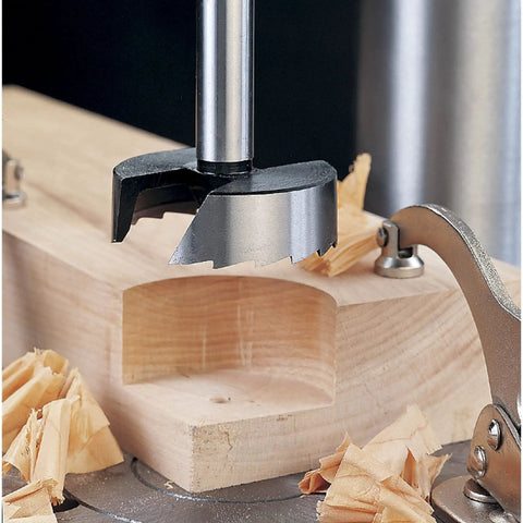 Battle Tested 16 Piece Forstner Drill Bit Set With Wood Storage Case And Killer Saw Tooth Design creating a precise hole in wood.
