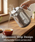 1.7L Large Electric Kettle With Thermometer, stainless steel, chrome finish pouring into a mug on kitchen counter