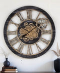 36 Inch Oversized Wall Clock With Real Moving Gears Vintage Industrial Decor Rustic Farmhouse Accent Piece Black Wood Bronze Finish on wall with gears visible.
