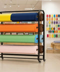 Dang Sturdy Heavy Duty Vinyl Roll Storage Rack, Commercial Fabric Holder With 20 Removable Bars, showcasing colorful rolls of fabric on a sturdy metal frame.