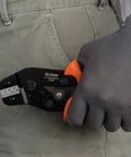 Person holding Open Barrel Crimping Tool For Dupont And JST XH VH Connectors 3.96mm 2.54mm 2.5mm Pitch AWG 18 To 28