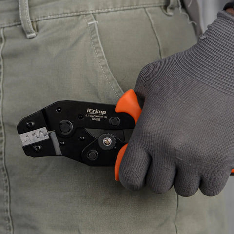 Person holding Open Barrel Crimping Tool For Dupont And JST XH VH Connectors 3.96mm 2.54mm 2.5mm Pitch AWG 18 To 28
