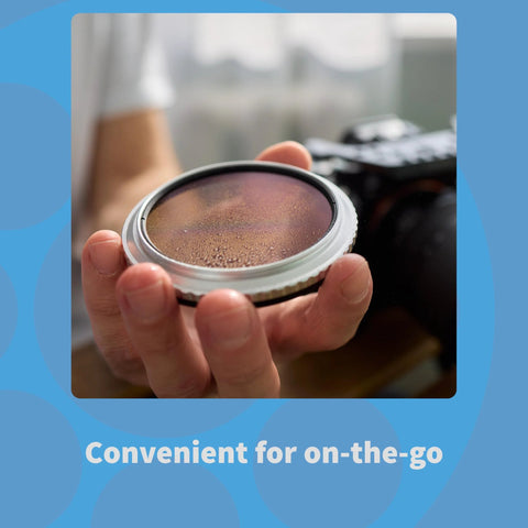 MidOpt optics cleaning kit; close-up of hands holding a round lens element with water droplets on surface