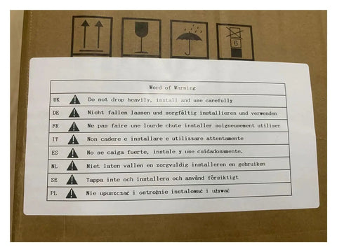 Multi-language safety warning on cardboard box with symbols indicating handling instructions.