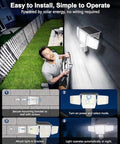 Person installing SZPOWER 6000LM Motion Sensor Outdoor Lights, 4 Heads 3 Modes Solar Flood Lights Outdoor on wall.