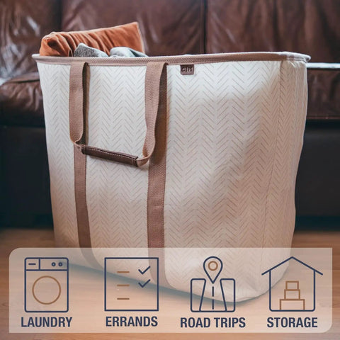 Grab And Go Collapsible Laundry Caddy Tote With Handles, XXL 64L Pop Up Laundry Basket in Luxe Cream Herringbone, near sofa