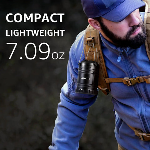 Person hiking with LED Lanterns Battery Powered For Camping And Outdoors, compact and lightweight, hanging from backpack