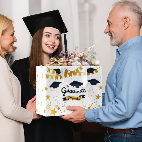 Graduation ceremony with graduate holding Two Pack 13 Inch Graduation Gift Bags With Tissue Paper Reusable Nonwoven Gift Bags