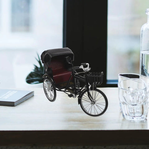 Absolutely Sweet Mini Motorcycle And Vintage Rickshaw Cake Topper With Detailed Metal Alloy Body set on a wooden table.