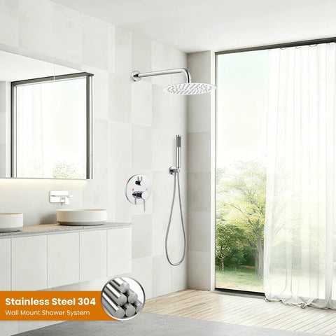 10 Inch Round Rainfall Shower System With Wall Mount High Pressure Shower Head Set Rough In Valve And Cylindrical Handheld Spray In Polished Chrome All Metal SUS304 Stainless Steel Construction Built Tough installed in a modern bathroom with large window.