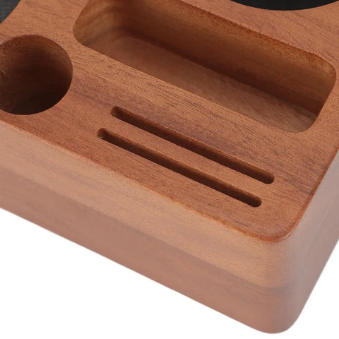 Close-up of Solid Built 58mm Wooden Coffee Tamper Station with adjustable holder and catch pan, showcasing wooden texture and holes.