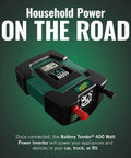 Top Rated 400 Watt Dc To Ac Power Inverter For Cars Rvs And Trailers Features Dual Ac Outlets Plus Two Usb Ports That Hella Crush Your Weekend Trips While The Smart Lcd Panel Monitors Real Time Voltage - close-up view of inverter with LCD display.