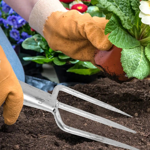 Gardener using 3 Prong Metal Garden Fork For Weeding And Planting Durable Iron Tool With Ergonomic Handle in the soil