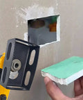 Heavy Duty Drywall Outlet Cutter For Oscillating Multi Tool cutting a rectangular hole in gypsum board, size 2.375 in x 3.75 in.