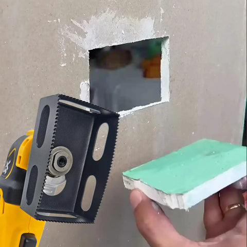 Heavy Duty Drywall Outlet Cutter For Oscillating Multi Tool cutting a rectangular hole in gypsum board, size 2.375 in x 3.75 in.