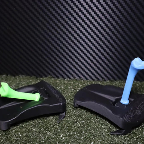 Stable Base Golf Tees And Ball Holder For Home Practice with green and blue tees on artificial grass.