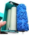 Top Tier 5 Inch Pattern Texture Paint Roller With Grippy Embossed Handle For Swift Diy Wall Murals And Slick Latex Coating That Covers Imperfections Like A Badass Champion in hand with detailed blue roller.