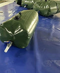 Foldable Water Storage Bladder With Faucet 110L Portable Camp Ready Collapsible Water Tank on blue surface
