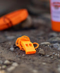 Orange whistle from the Orange Nautical Safety Kit For Paddle Sports And Boating No Brainer Gear With Waterproof Headlamp Six Lighting Modes