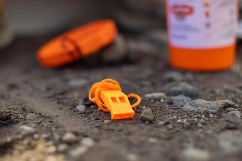 Orange whistle from the Orange Nautical Safety Kit For Paddle Sports And Boating No Brainer Gear With Waterproof Headlamp Six Lighting Modes