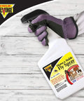 Gloved hand holding Horse And Stable Fly Spray Ready To Use 32 Oz Long Lasting Bug Killer Insecticide bottle