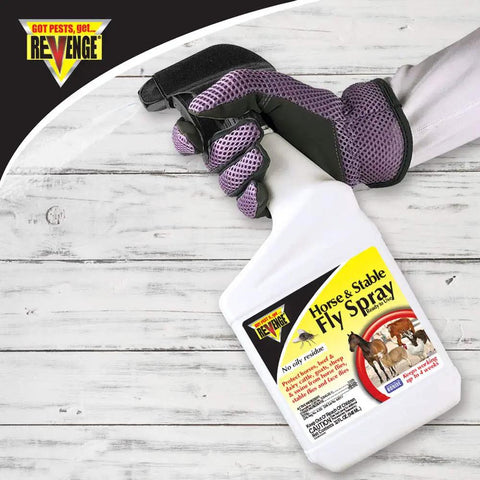 Gloved hand holding Horse And Stable Fly Spray Ready To Use 32 Oz Long Lasting Bug Killer Insecticide bottle
