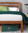 Full Size Bamboo Platform Bed Frame With Sleek Slatted Headboard showing green bedding and storage drawer.