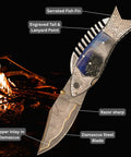 Fish Style Folding Knife With Ladder Pattern Damascus Blade And Blue Resin Handle in front of a campfire.