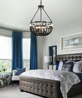 Boho Beaded Chandelier With Five Lights 16 Inch Black And White Modern Farmhouse Wood Bead Pendant Lighting in bedroom setting