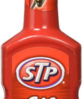 STP Gas Treatment 5.25 Ounce Fuel Additive, red bottle, designed to improve gas quality and engine performance.