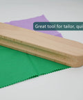 Wooden Clapper Tool For Pro Sewing And Quilting Nine Point Five Inch Hardwood Ironing Clapper shown on fabric