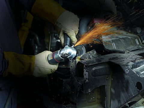Heavy Duty Air Angle Grinder With A Beefy 5 Inch Cut Off Wheel cutting metal, sparks flying from 12000 RPM grind.