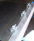Acrux7 butt welding clamps, three small square-channel sheet metal panel clamps installed along a metal edge