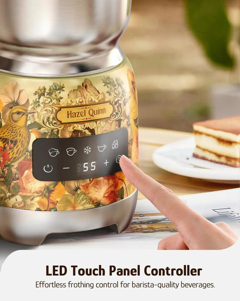 Close-up of LED touch panel on detachable milk frother with four temperature settings and floral design.