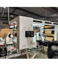 Industrial Smooth Operation Heavy Duty Automatic Jumbo Roll Slitter Machine Featuring Differential Slip Shaft For Insulation Paper Sheets and job ready site setup in factory.