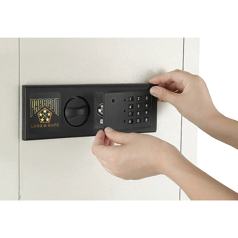 Person using LED keypad on an In Wall Safe For Home Or Biz With LED Keypad And Two Manual Override Keys Big Interior For Cash Jewelry Passports And More Discreet Hidden Safe You Can Access Fast And Easy