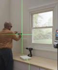 GLL50-20G 50 Ft Green-Beam Self-Leveling Cross-Line Laser With Integrated Magnetic Mount in use for cabinet installation