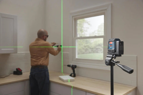 GLL50-20G 50 Ft Green-Beam Self-Leveling Cross-Line Laser With Integrated Magnetic Mount in use for cabinet installation