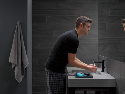 Person using High Arc Matte Black Lavatory Faucet With 1 Or 3 Hole Install in modern bathroom