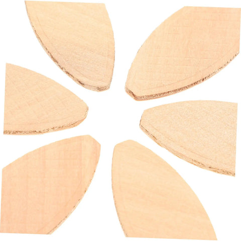Close-up view of six light yellow hardwood discs from the 100 Piece Hardwood Biscuit Joiner Set for Woodworkers Tongue and Groove Board Carving.