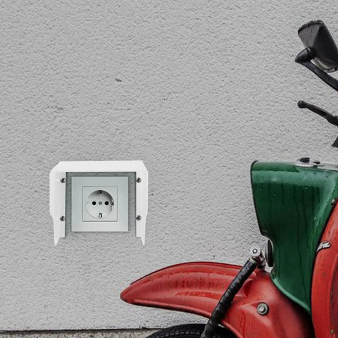 Heavy Duty White Iron EV Charging Station Rain Cover Wall Mount Waterproof Outlet Box For Electric Bikes beside red motorcycle.