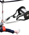 Heavy Duty Slack Line Pulley System With 440 Lb Capacity for backyard obstacle courses, shown in use with a seated user on zip line.