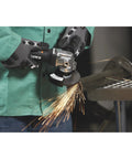 Using No Nonsense 4 1/2 Inch Air Angle Grinder Cranking 12000 RPM on metal, producing sparks during grinding.