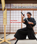 43 Inch Solid Pine Kendo Tameshigiri Practice Cutting Stand Real Deal Heavy Duty Wooden Dummy Holder For Katana Training Stable Durable Platform With Varnish Finish And Safe Mat Area shown in use with martial artist