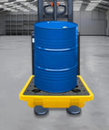 Spill Containment Pallet With Drain 26.4 By 26.4 By 5.9 Inches HDPE holding a blue drum in an industrial setting