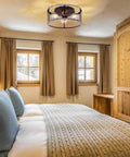 Bedroom with Rustic 3 Light Flush Mount Ceiling Fixture, Vintage Farmhouse Open Cage Metal Frame, Matte Wood Finish.