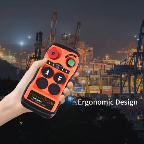 Front view of orange handheld Q200 industrial crane remote control with green start button and arrow keys
