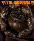 Vietnam Nha Trang Agarwood Unisex Jewelry burl scarred bracelet with black oil-aged appearance around incense holder.