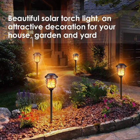Solar Torch Lights Outdoor Flickering Flame Lit Set Of 4 Metal Pathway Lights Waterproof Landscape Decor Auto On Off Dusk Till Dawn For Patio Garden Yard Pool installed along a garden pathway.